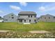 Well-manicured backyard featuring a two story home, offering ample space for recreation at 2024 Embassy Ct # 49, Charlotte, NC 28213