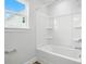 Bright bathroom featuring a bathtub and a window at 2024 Embassy Ct # 49, Charlotte, NC 28213
