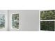 Light bedroom featuring multiple windows with neighborhood views at 2024 Embassy Ct # 49, Charlotte, NC 28213