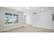 This bedroom has large windows with a view and neutral walls and carpet at 2024 Embassy Ct # 49, Charlotte, NC 28213