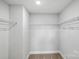 Walk-in closet features wire shelving and neutral carpeting at 2024 Embassy Ct # 49, Charlotte, NC 28213