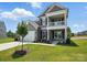 Charming two-story home with inviting front porch and landscaped yard at 2024 Embassy Ct # 49, Charlotte, NC 28213