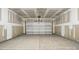 Spacious two-car garage with concrete flooring ready for customizations at 2024 Embassy Ct # 49, Charlotte, NC 28213