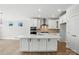 Modern kitchen with white cabinets, a spacious island, and stainless steel appliances at 2024 Embassy Ct # 49, Charlotte, NC 28213