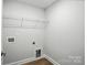 Laundry room with utility connections and base trim molding at 2024 Embassy Ct # 49, Charlotte, NC 28213