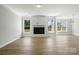 Spacious living room with fireplace and large windows offering plenty of natural light at 2024 Embassy Ct # 49, Charlotte, NC 28213
