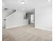 Comfortable living room featuring neutral carpeting and an open floor plan at 2024 Embassy Ct # 49, Charlotte, NC 28213