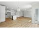 Spacious living area featuring modern finishes, hardwood floors, and an open floor plan at 2024 Embassy Ct # 49, Charlotte, NC 28213