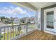 View from a porch featuring gray siding and white railings at 2024 Embassy Ct # 49, Charlotte, NC 28213