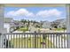 View from a porch of the street featuring matching gray and white houses at 2024 Embassy Ct # 49, Charlotte, NC 28213