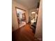 Hardwood floor hallway with views of dining and living rooms at 2595 Shamrock Rd, Harrisburg, NC 28075