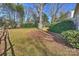 Private backyard with mature trees and a large grassy area at 2608 Innsbrook Rd, Charlotte, NC 28226