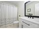 Bathroom with white vanity, black fixtures, and shower/tub combo at 2608 Innsbrook Rd, Charlotte, NC 28226