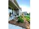 Inviting front porch features a cozy seating area and well-maintained landscaping at 3100 Glacier Ct, Gastonia, NC 28056