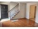 Inviting entryway with hardwood floors and a staircase leading upstairs at 3508 Colony Rd # H, Charlotte, NC 28211
