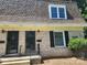 Brick front exterior of a charming twin home with a neatly landscaped yard at 3508 Colony Rd # H, Charlotte, NC 28211