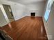 Spacious living room featuring hardwood floors and a fireplace at 3508 Colony Rd # H, Charlotte, NC 28211