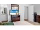 Bright bedroom with wood dresser, TV, and ensuite bathroom access at 506 Broadway Ct # 9, Statesville, NC 28677
