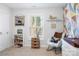 Charming Bedroom with colorful wall, rocking chair, and bookshelves at 506 Broadway Ct # 9, Statesville, NC 28677