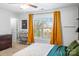 Spacious bedroom with large window and mustard curtains at 506 Broadway Ct # 9, Statesville, NC 28677