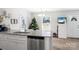 Modern kitchen with white cabinets and granite island at 506 Broadway Ct # 9, Statesville, NC 28677