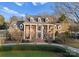 Brick colonial home with large driveway and lush landscaping at 5401 Sunningdale Dr, Charlotte, NC 28277
