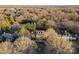 Large home on a tree-lined street with a circular driveway at 5401 Sunningdale Dr, Charlotte, NC 28277