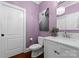 Elegant bathroom with white vanity, purple walls and modern fixtures at 5401 Sunningdale Dr, Charlotte, NC 28277
