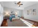 Bright bedroom with hardwood floors, neutral decor and ceiling fan at 5401 Sunningdale Dr, Charlotte, NC 28277