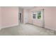 Bright bedroom with neutral walls and carpet at 5401 Sunningdale Dr, Charlotte, NC 28277