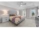 Spacious bedroom with gray upholstered bed and plush carpet at 5401 Sunningdale Dr, Charlotte, NC 28277