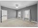 Well-lit bedroom with neutral walls and carpet at 5401 Sunningdale Dr, Charlotte, NC 28277