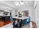 Breakfast nook with round table and blue chairs near the kitchen at 5401 Sunningdale Dr, Charlotte, NC 28277
