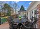 Deck with table and chairs, offering a relaxing outdoor space at 5401 Sunningdale Dr, Charlotte, NC 28277