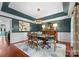Elegant dining room with dark wood furnishings and blue accents at 5401 Sunningdale Dr, Charlotte, NC 28277