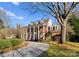 Brick home with columns and landscaped yard at 5401 Sunningdale Dr, Charlotte, NC 28277