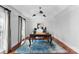 Bright home office features hardwood floors and large windows at 5401 Sunningdale Dr, Charlotte, NC 28277