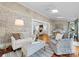 Sunroom with brick walls, hardwood floors and views of backyard at 5401 Sunningdale Dr, Charlotte, NC 28277
