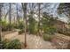 Backyard path through trees and landscaping at 5550 Monticello Nw Dr, Concord, NC 28027
