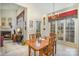 Bright dining area with wood table and chairs, adjacent to kitchen and fireplace at 5550 Monticello Nw Dr, Concord, NC 28027