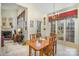 Bright dining area with wood table and chairs, adjacent to kitchen and fireplace at 5550 Monticello Nw Dr, Concord, NC 28027