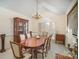 Formal dining room with wood table and chairs, and large window at 5550 Monticello Nw Dr, Concord, NC 28027