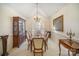 Formal dining room with wood table and chairs, and large window at 5550 Monticello Nw Dr, Concord, NC 28027