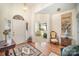 Bright entryway with hardwood floors and views into the living room at 5550 Monticello Nw Dr, Concord, NC 28027
