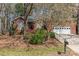 Beautiful home with a well-maintained lawn, mature trees, and an attached garage, offering both curb appeal and convenience at 5550 Monticello Nw Dr, Concord, NC 28027