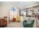 Cozy library with built-in bookshelves, comfortable seating, and a large window at 5550 Monticello Nw Dr, Concord, NC 28027