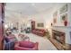 Living room with fireplace and comfortable plaid sofas at 5550 Monticello Nw Dr, Concord, NC 28027
