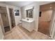 Updated bathroom with a large shower and vanity at 6200 George Hildebran School Rd, Hickory, NC 28602