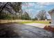 Spacious backyard with a large patio area and wooden fence at 7001 Starvalley Dr, Charlotte, NC 28210