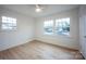 Well-lit bedroom with hardwood floors and ample closet space at 7001 Starvalley Dr, Charlotte, NC 28210